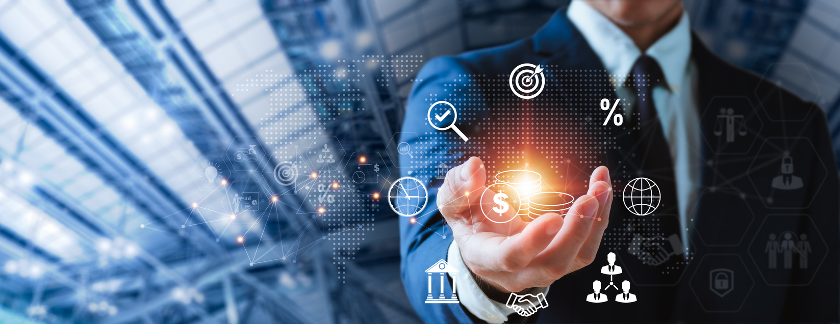 A businessman holds a glowing cluster of financial icons above his open palm.