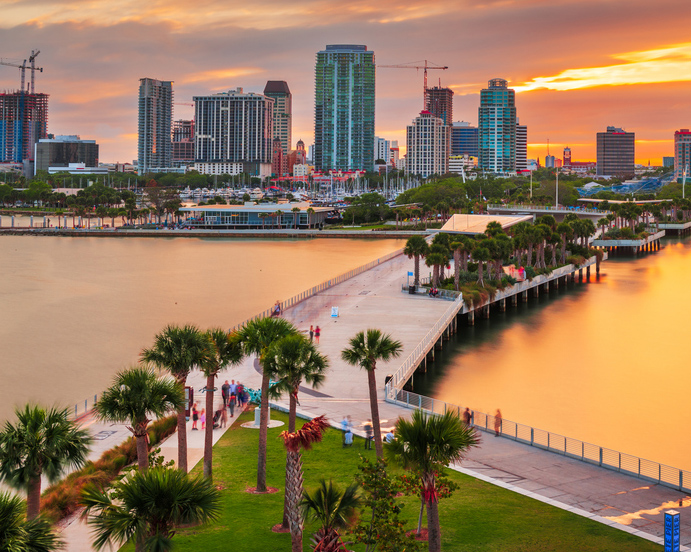 The St Petersburg, Florida skyline over the bay at dusk.